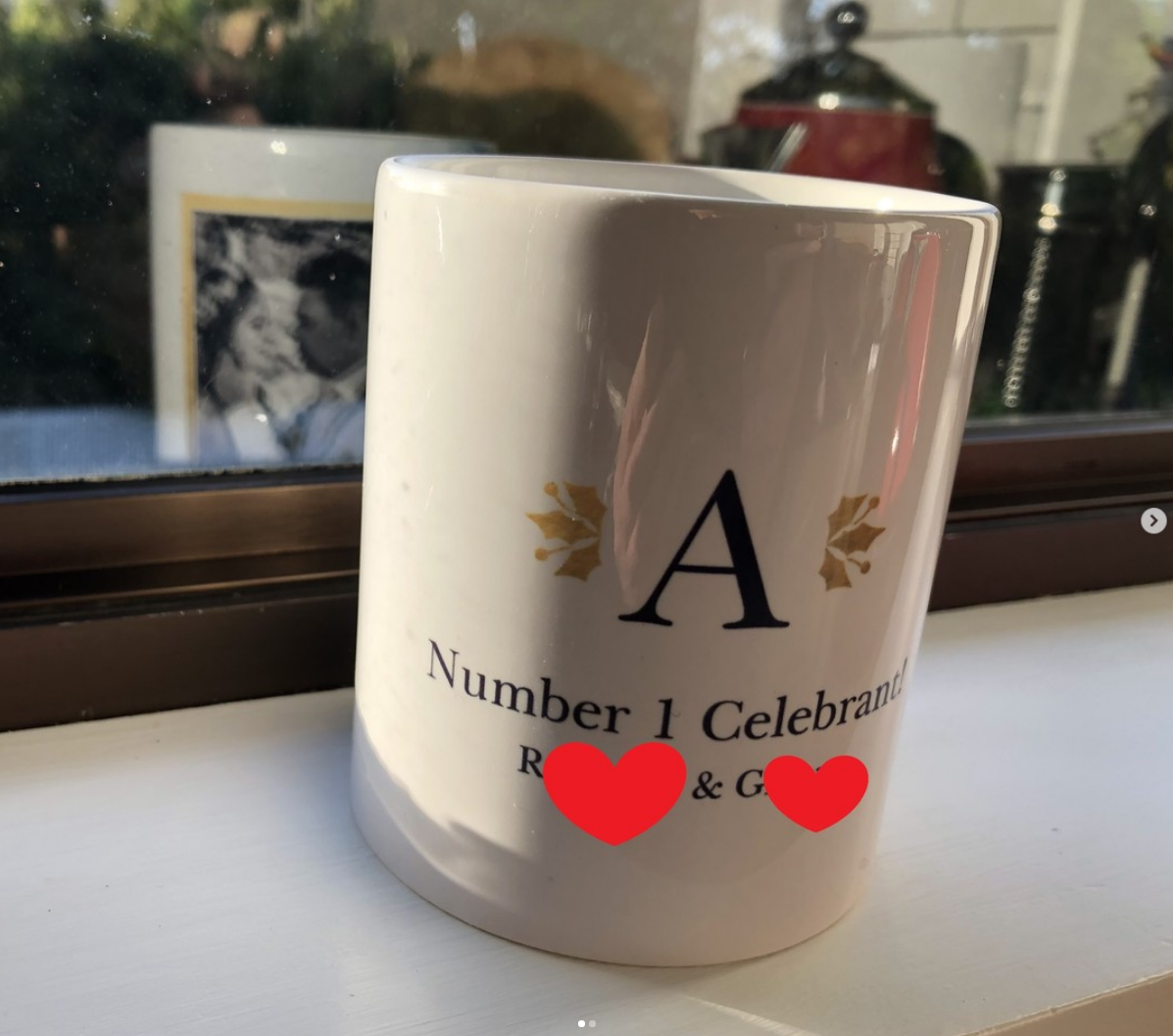 Personalised celebrant keepsake mug by a sunlit window